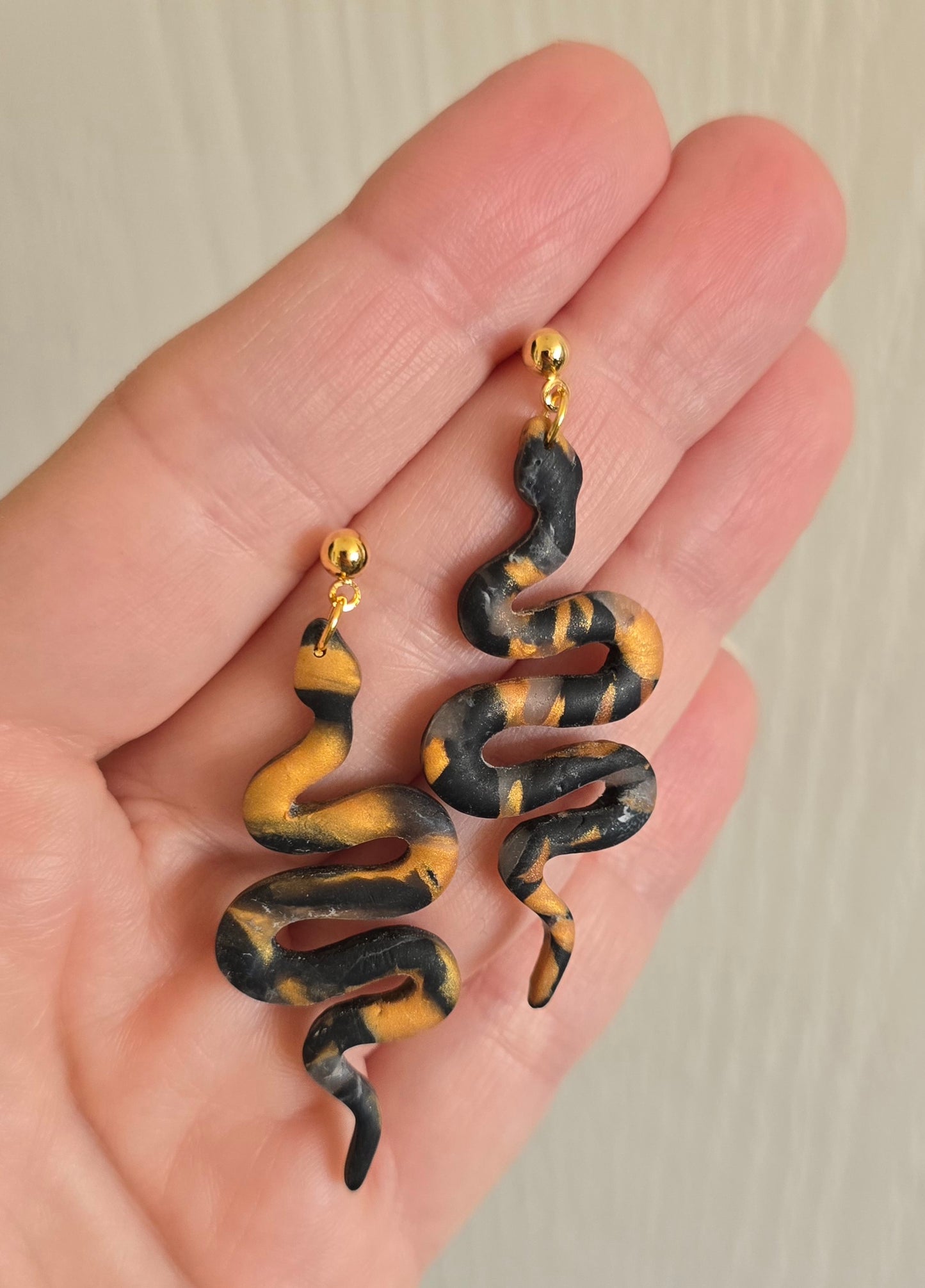 Black and Gold Snake Dangle Earrings