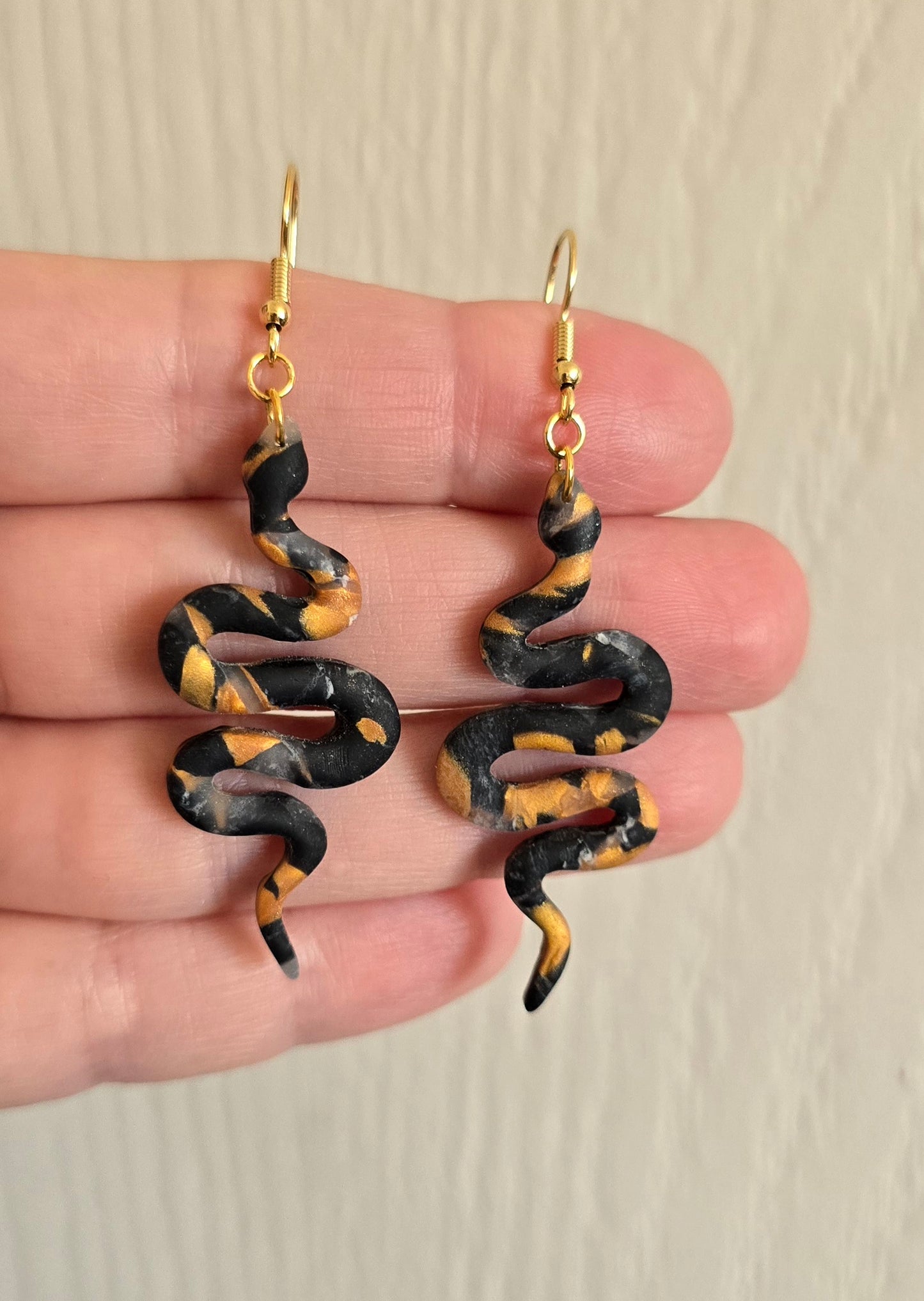 Black and Gold Snake Dangle Earrings