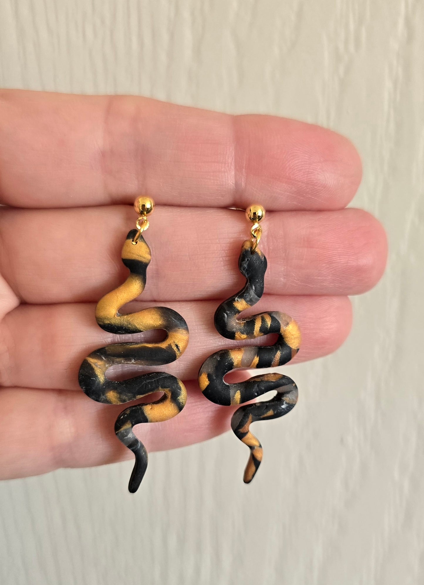 Black and Gold Snake Dangle Earrings