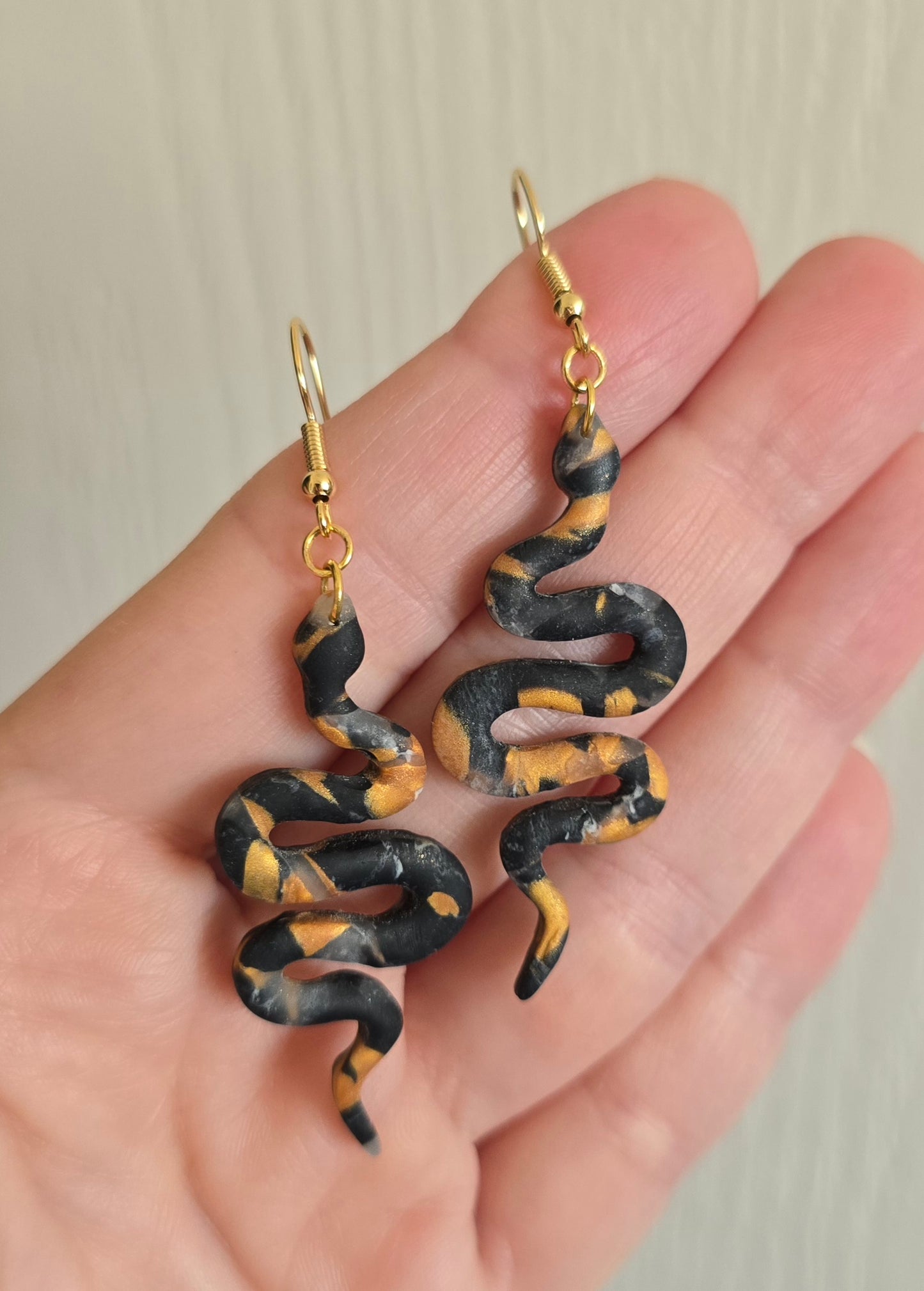 Black and Gold Snake Dangle Earrings